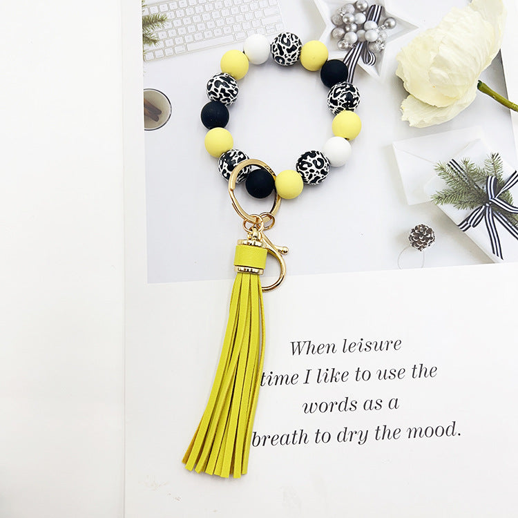 Wholesale Leopard Print White Bottom Wooden Beads Rubber Paint Round Beads PU Tassel Bracelet Keychain